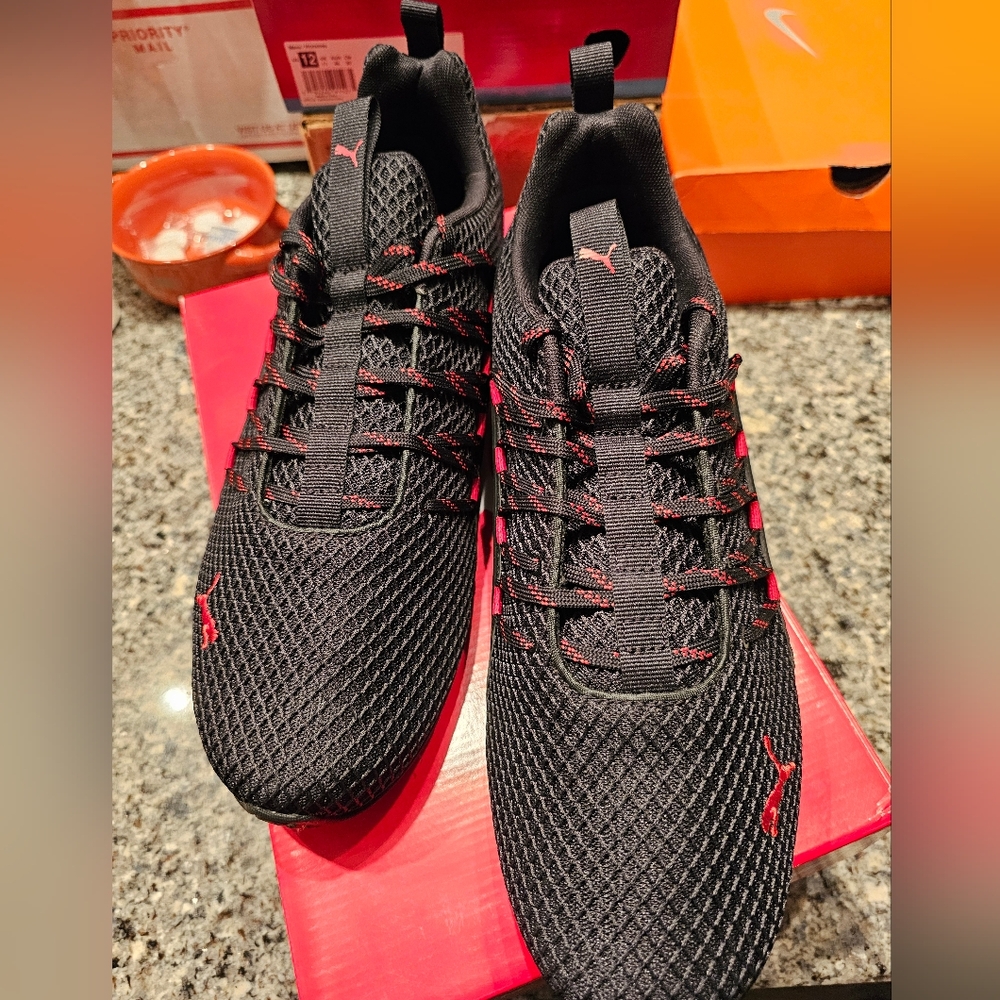 Mens size 12 black and red Puma shoes